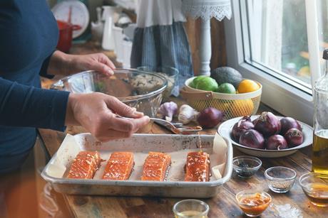 Preparing Spicy Salmon Bowl with Rice, Carrots, Cucumber and Avocado
