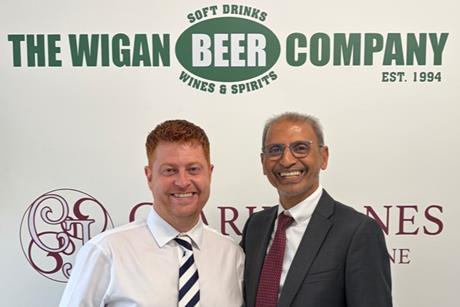 Wigan Beer Company MD Adam Jones (left) with LWC MD Ebrahim Mukadam (right)