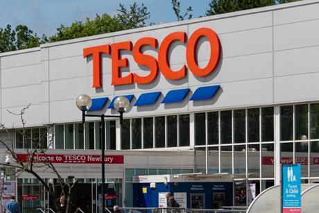 tesco store sign: job cuts 2025