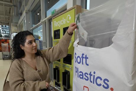 Shopper recycling soft plastic tesco