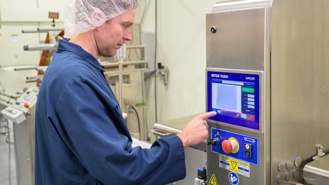 Man using a tech device, used for checking food contamination