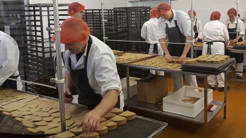 Staff picking up oatcakes cropped