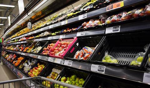 Supermarket apples fruit aisle Getty