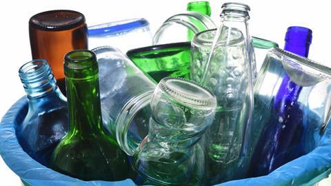 Glass drink bottle in waste