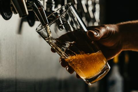 pint of beer pulling unsplash
