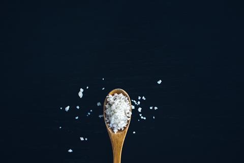 Rock salt on a wooden spoon