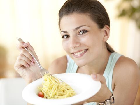 Woman eating pasta