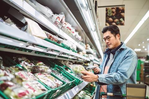 shopper waitrose fruit veg scan as you shop supermarket man GettyImages-1481658461