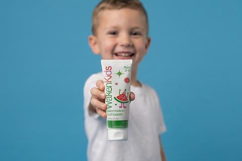 Waken Kids Toothpaste Arm Outstretched