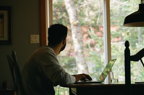 Man on laptop working from home