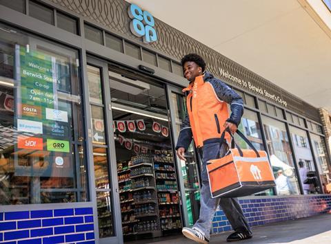 JET courier walking into Co-op
