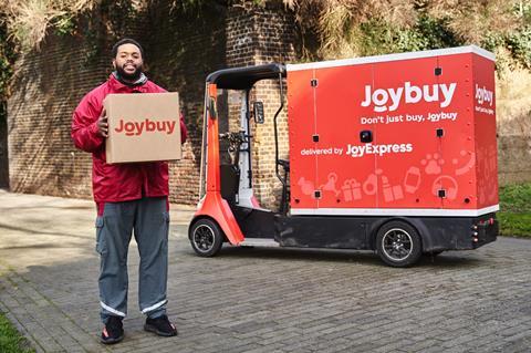 joyexpress-courier-standing-with-package-joybuy-2026-scaled