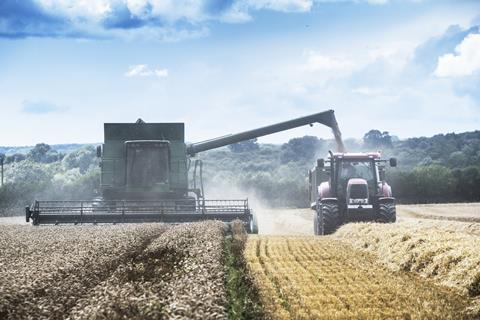 comvbine harvestor and tractor - getty