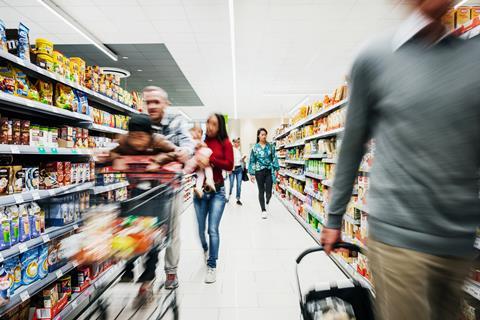 Busy Supermarket Aisle With Customers