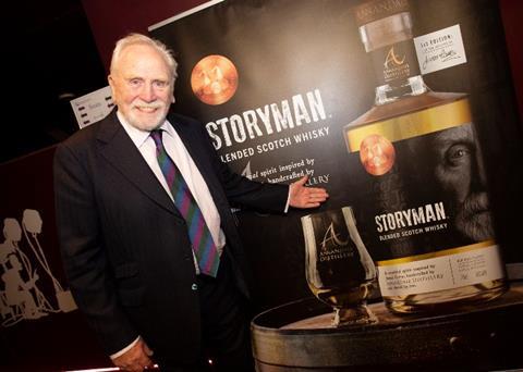James-Cosmo-in-front-of-STORYMAN-promotional-banner
