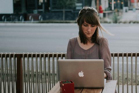 Woman looking at her laptop