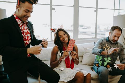 Three people at an office Christmas party
