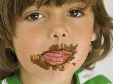 child eating chocolate