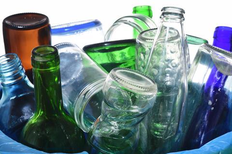 Glass drink bottle in waste