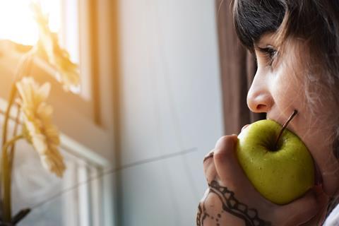 child eating apple