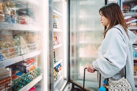women in freezer aisle - getty