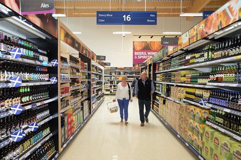 tesco shoppers in alcohol aisle