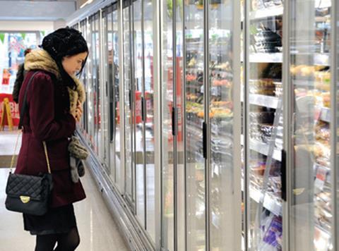 The Co-op chiller doors shopper