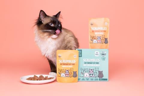 Scrumbles cat food pouches with cat licking lips