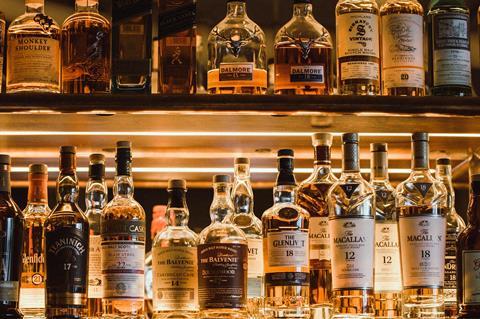 whisky shelf bar unsplash