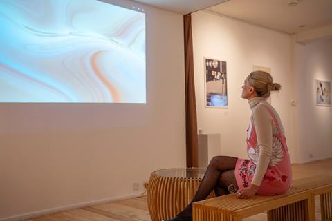A woman looks at some coffee art in Breville's café