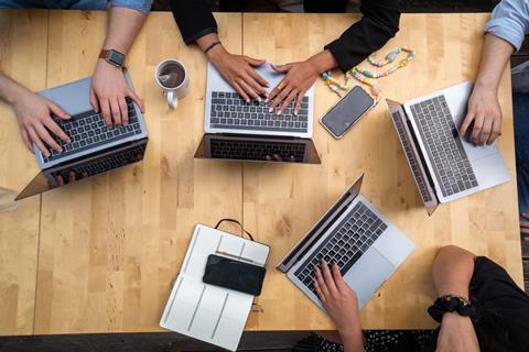 Colleagues working on laptops