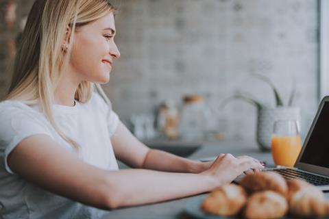 woman on laptop in kitchen