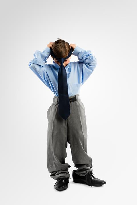 Child in a suit GettyImages-188071397