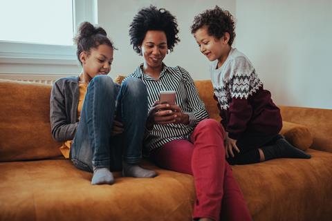 Family mother and children phone