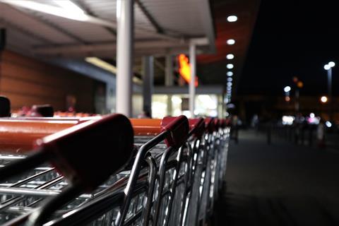 sainsburys trolley supermarket night unsplash