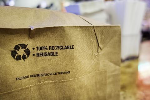recycled packaging recycle eco sustainable bag paper GettyImages-1344240174