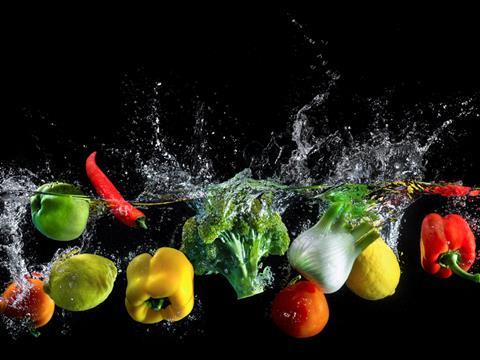 Fruit and veg splashing in water