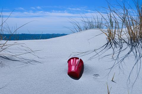 plastic cup on beach