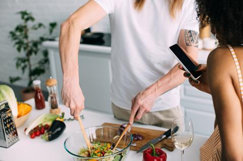 couple cooking healthy meal salad