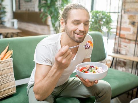 man eating vegan vegetarian salad food