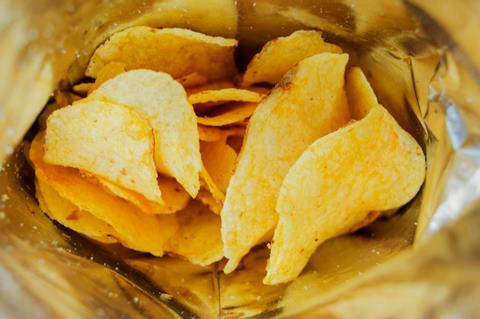 Potato crisps in an open bag