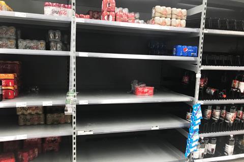 Asda near-empty soft drink shelves 