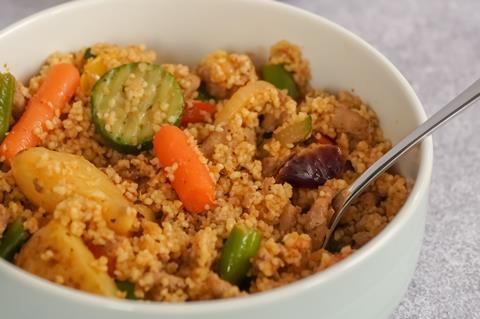 Two bowls of couscous with vegetables