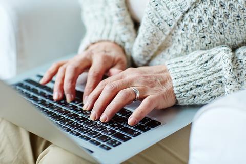 elderly woman on laptop computer online