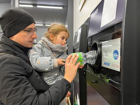 drs deposit return scheme bottle recycling plastic machine GettyImages-1469751090