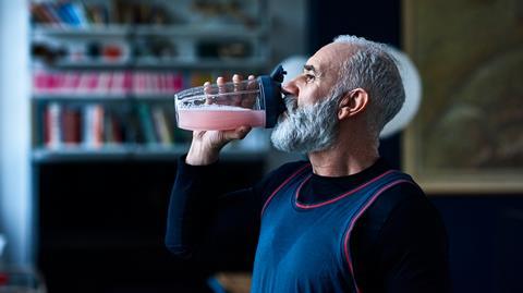 man drinking protein shake