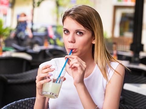 woman drinking lemonade soft drink straw