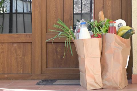 grocery delivery bags on doorstep