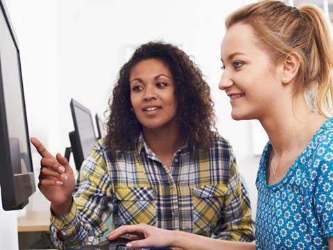 Young woman receiving training in the workplace