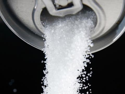 Sugar pouring out of a soft drinks can